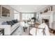 Spacious living room with neutral tones, fireplace, piano, and lots of natural light at 8001 N Illinois St, Indianapolis, IN 46260