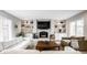 Comfortable living room with a fireplace, built-in shelving, and ample seating for entertaining guests at 8001 N Illinois St, Indianapolis, IN 46260