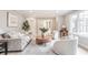 Inviting living room featuring neutral decor, a round wood coffee table, and ample seating at 8001 N Illinois St, Indianapolis, IN 46260