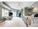 Bright main bedroom with seating area, large window and a calming color scheme at 8001 N Illinois St, Indianapolis, IN 46260