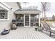 Backyard screened porch with outdoor furniture and barbeque grill at 8001 N Illinois St, Indianapolis, IN 46260