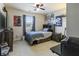 Bedroom features a bed with a headboard, a ceiling fan and a window with curtains at 8193 Cagles Mill Trce, Avon, IN 46123
