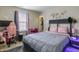 Bedroom features pink gaming chair, a modern bed and a window with curtains at 8193 Cagles Mill Trce, Avon, IN 46123