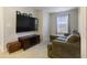 Bonus room features a large TV, comfortable seating, and a relaxing atmosphere for entertainment at 8193 Cagles Mill Trce, Avon, IN 46123