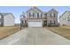 Charming two-story home with a two-car garage, a basketball hoop, and a well-manicured lawn at 8193 Cagles Mill Trce, Avon, IN 46123