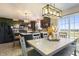 Eat-in kitchen boasts sleek cabinetry, stainless steel appliances, stylish lighting, and sliding glass doors at 8193 Cagles Mill Trce, Avon, IN 46123