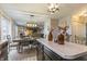 Open layout combines the eat-in kitchen with stainless appliances, dining area, and living area at 8193 Cagles Mill Trce, Avon, IN 46123