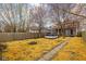 Wide shot of backyard with wooden fence, tree and above ground pool at 825 N Bancroft St, Indianapolis, IN 46201