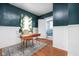 Stylish bedroom with a hardwood desk, natural lighting, and calming wall colors at 825 N Bancroft St, Indianapolis, IN 46201