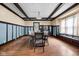 Spacious dining area with wood floors, natural light, and stylish furniture at 825 N Bancroft St, Indianapolis, IN 46201