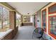 Cozy front porch featuring brick pillars and relaxing seating area with chairs at 825 N Bancroft St, Indianapolis, IN 46201