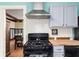 Well-appointed kitchen showcasing updated appliances and a view into the dining room at 825 N Bancroft St, Indianapolis, IN 46201