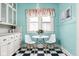 Bright breakfast nook with a table and chairs, surrounded by charming blue walls at 825 N Bancroft St, Indianapolis, IN 46201