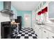 Classic kitchen with black appliances, white tile backsplash, and ample cabinet space at 825 N Bancroft St, Indianapolis, IN 46201
