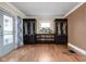 Bright living area featuring beautiful hardwood floors and decorative built-ins at 825 N Bancroft St, Indianapolis, IN 46201