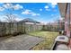 Fenced backyard with a patio area and lawn, providing a private outdoor space and room for entertaining at 959 E Bradbury Ave, Indianapolis, IN 46203