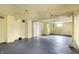 Unfinished basement with painted concrete floor, white walls, and open layout, suitable for various uses at 959 E Bradbury Ave, Indianapolis, IN 46203