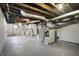 Unfinished basement with exposed utilities and ductwork at 959 E Bradbury Ave, Indianapolis, IN 46203