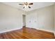 Spacious bedroom with gleaming hardwood floors and neutral paint at 959 E Bradbury Ave, Indianapolis, IN 46203