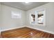 Bright bedroom with hardwood floors and large windows providing natural light at 959 E Bradbury Ave, Indianapolis, IN 46203