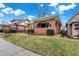 Charming brick home featuring a cozy front porch, complemented by manicured landscaping and a well-maintained lawn at 959 E Bradbury Ave, Indianapolis, IN 46203