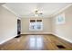 Bright living room with hardwood floors, archway, and large windows, creating a warm and inviting atmosphere at 959 E Bradbury Ave, Indianapolis, IN 46203