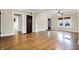 Spacious living room boasting gleaming hardwood floors, neutral paint, archways, and abundant natural light at 959 E Bradbury Ave, Indianapolis, IN 46203