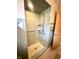 Tiled walk-in shower with convenient grab bars and a handheld shower head at 1005 Cameron St, Indianapolis, IN 46203