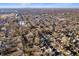 Wide aerial shot of a residential area, tree-lined streets, and distant city skyline at 1020 E 51St St, Indianapolis, IN 46205