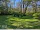 Expansive backyard with well-maintained lawn and inviting fire pit area at 1020 E 51St St, Indianapolis, IN 46205