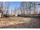Backyard featuring a shed and tree-lined perimeter at 1020 E 51St St, Indianapolis, IN 46205