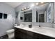 Bathroom featuring a double sink vanity, and decorative mirror at 1020 E 51St St, Indianapolis, IN 46205