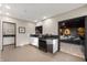 Open-concept kitchen with sleek countertops, modern appliances, and seamless flow to the living area at 1020 E 51St St, Indianapolis, IN 46205