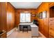 Bright home office with a modern desk, ample natural light, and wood-paneled walls, perfect for productivity at 1020 E 51St St, Indianapolis, IN 46205