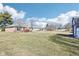 Expansive backyard with lush greenery, a shed for extra storage, and mature trees at 10709 E County Road 100 N, Indianapolis, IN 46234