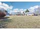 Large backyard providing ample space and potential for various outdoor activities and landscaping projects at 10709 E County Road 100 N, Indianapolis, IN 46234