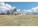 Spacious backyard offering plenty of room for outdoor activities and potential for landscaping at 10709 E County Road 100 N, Indianapolis, IN 46234