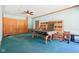 Large basement with a pool table, built-in storage, and ample space for activities at 10709 E County Road 100 N, Indianapolis, IN 46234