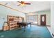 Spacious basement featuring a pool table, storage boxes, and good lighting at 10709 E County Road 100 N, Indianapolis, IN 46234