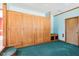 Basement featuring large closet area, built-in bench, and neutral-colored walls at 10709 E County Road 100 N, Indianapolis, IN 46234