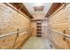 This expansive closet features beautiful wood paneling, shelving and rods for storage at 10709 E County Road 100 N, Indianapolis, IN 46234