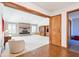 Open living room boasts a brick fireplace, built-in cabinets, and neutral carpeting at 10709 E County Road 100 N, Indianapolis, IN 46234