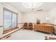 Bright office featuring large window, chandelier, and trim accents at 10709 E County Road 100 N, Indianapolis, IN 46234