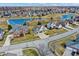 Stunning aerial view of a neighborhood with well-maintained homes, lush green spaces, and picturesque ponds, a perfect location at 10896 Fairwoods Dr, Fishers, IN 46037