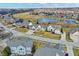 Beautiful aerial view of a suburban neighborhood with a pond and well-maintained green spaces at 10896 Fairwoods Dr, Fishers, IN 46037