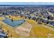 Overhead perspective of a community featuring scenic ponds, manicured lawns, and inviting walking paths at 10896 Fairwoods Dr, Fishers, IN 46037