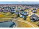 High-angle aerial photo showcasing lush lawns, ponds, and inviting pools in a well-maintained community at 10896 Fairwoods Dr, Fishers, IN 46037
