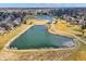 Panoramic aerial showcasing community with interconnected ponds, lush walking paths, and manicured green spaces at 10896 Fairwoods Dr, Fishers, IN 46037