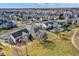 Aerial view of a suburban community with lush lawns, mature trees, and inviting backyard pools at 10896 Fairwoods Dr, Fishers, IN 46037