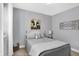 Neutral bedroom with simple bed frame, cow art and bright natural light at 10896 Fairwoods Dr, Fishers, IN 46037